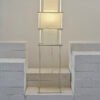 Luminária de piso para iluminação difusa. Estruturas ultrafinas de aluminio que sustenta tecidos translúcidos.